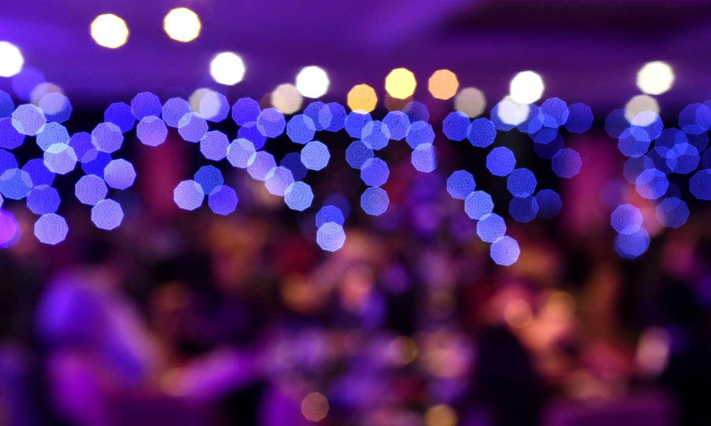 Proclaim Care shortlisted at the CMS UK awards 2022 - image of blurred lights at an awards show